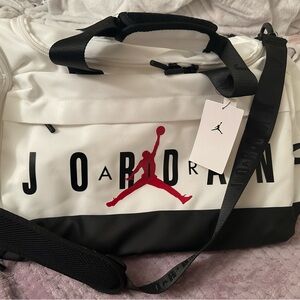 Jordan Black and White Duffel Bag with Red Logo